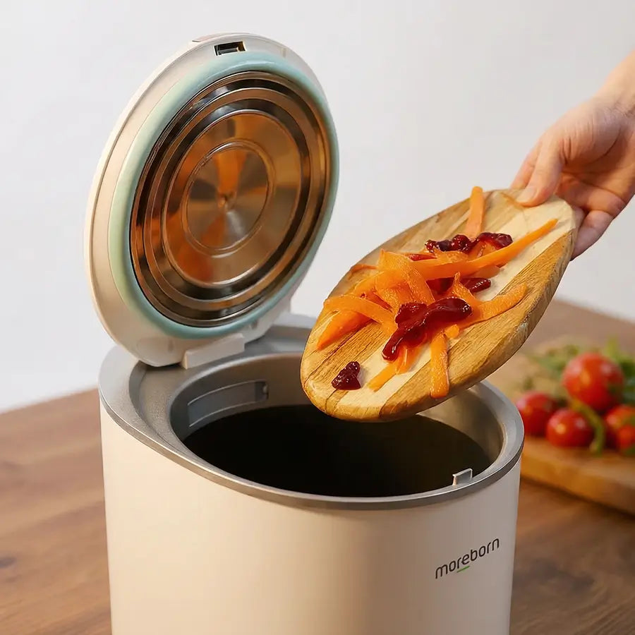 Adding fresh vegetable scraps and carrot peels into the Moreborn MB12.