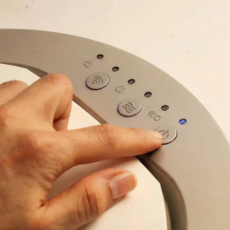 Detail of Moreborn composter touch control panel with Eco and WiFi indicators.