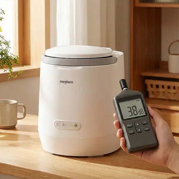 Noise level test of Moreborn composter showing 38dB on a decibel meter, highlighting its quiet operation.