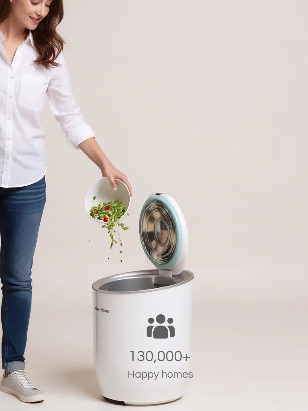 A user emptying food waste into the Moreborn MB12 composter, featuring the text 130,000+ Happy Homes to show brand trust.