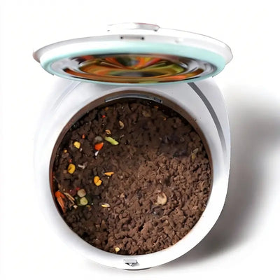 Interior view of MB12 smart composter showing a near 100% complete fermentation process where almost all food waste has been transformed into fine, dark brown organic fertilizer with no visible residues.