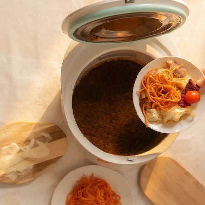 Scraping dinner leftovers and pasta into the Moreborn MB12 electric composter.